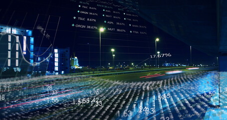 Displaying urban highway with blurred red light trails by street lamps at night with data overlays