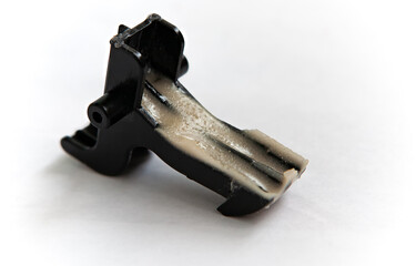 A broken small part from a household vacuum cleaner was glued and reinforced using a composite...