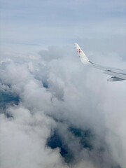 Airplane wing in the clouds
