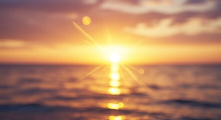 Tranquil sunset over ocean with golden sky reflecting on waves