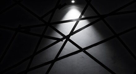 A minimalist black-and-white tape design arranged diagonally across a concrete wall.