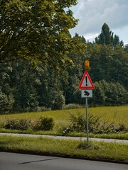 German frog warning sign on a road in nature