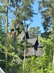 Old wooden church in forest. Gol Stave church. Medieval wooden Christian structure. Old wooden fence. Gol, Norway
