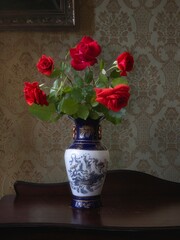 Still life with bouquet of red roses