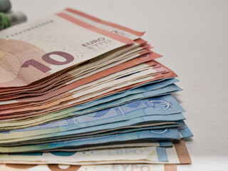 Closeup shot of a pile of ten and twenty Euro banknotes