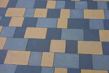 Colorful paving stones arranged in a distinctive geometric pattern on a walkway