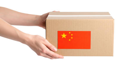 A hand holding a cardboard box with the China flag