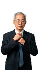 A distinguished Asian businessman adjusts his tie, exuding confidence and professionalism.