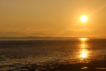 Sunset over water and mountains in Alaska