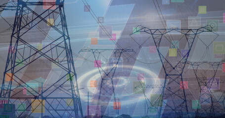 Extending transmission towers and power lines over fields showing colored holographic overlays