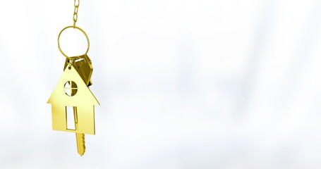 Displaying gold house-shaped keychain pendant with two gold keys against white backdrop, copy space