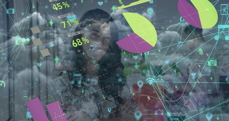 Analyzing business casual professionals using transparent display in office, with data visuals