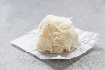 Traditional Turkish sweet. Pismaniye. Light halva, sweet cotton in the form of threads in a ball....