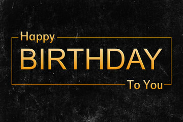 Happy birthday in golden letters on a black surface