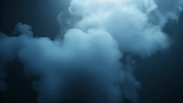 Soft blue smoke clouds floating in dark background  
