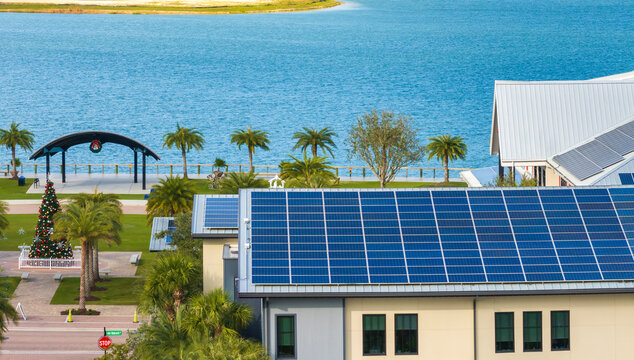 Autonomous building in Florida with photovoltaic rooftop covered with solar panels for producing of clean ecological electrical energy in town center