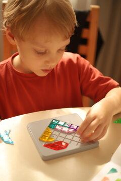 little boy playing with blocks