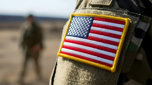 American soldier with US flag patch on uniform, standing in desert landscape. Ideal for military themes, patriotism, armed forces recruitment, veteran stories, national security.