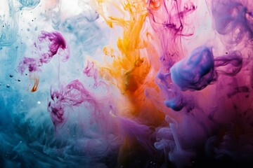 Obraz premium Abstract colorful ink swirling in water creating a vibrant and dynamic composition.