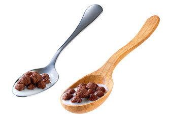 Spoon of tasty crispy chocolate corn balls with milk isolated on white background.
