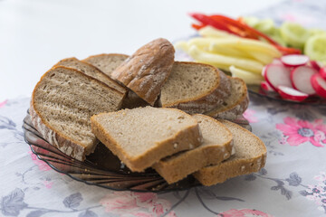 Sliced ​​bread on a plate is on the breakfast table
