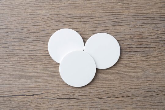 White circle paper and space for text on old wooden background.