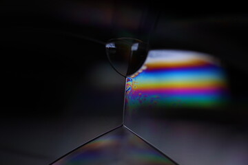 Bright rainbow reflection of liquid in macro, silver colors, surrealistic background, fantastic...