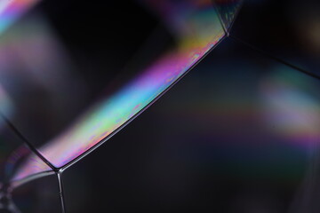 Bright rainbow reflection of liquid in macro, silver colors, surrealistic background, fantastic smooth movement, silver concept, silver ink