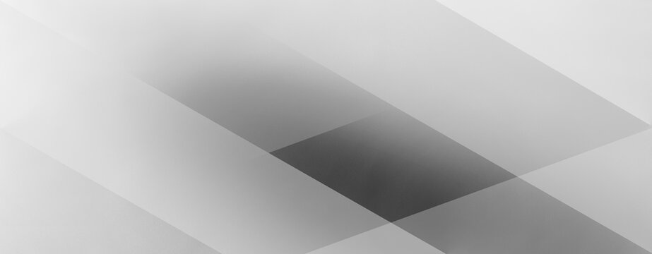 Monochrome geometric background with translucent intersecting shapes and a soft textured surface. The composition builds depth through gradients from dark to light grey. Wide panoramic banner
