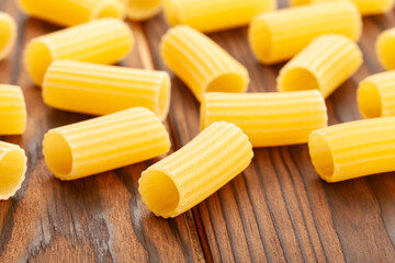pasta rigatoni on wood background