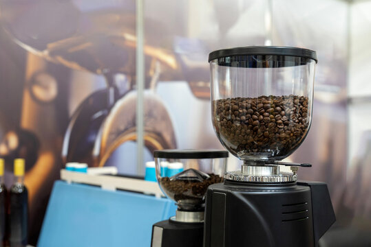 Coffee grinders filled with roasted beans