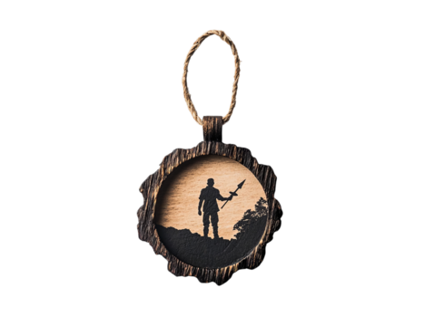 Silhouette of a soldier holding a weapon, carved on wood, evoking themes of bravery and sacrifice.