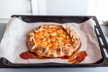 Close up view of baker is working. Homemade pie. Hands preparing dough on table. 