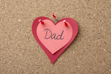 Fototapeta premium Fathers day heart message on corkboard