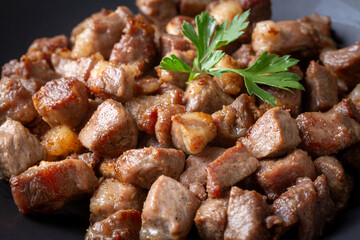 Muslims Traditional Sacrifice holiday food lamb, Turkish roasted meat in copper pot on table top. Turkish Kavurma. (Turkish name; Kurban kavurma)