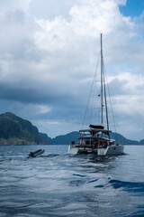 Catamaran sailing boat on the water in El Nido, Philippines.
