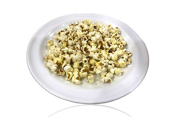 Yummy Pop corns in a plate isolated on white background