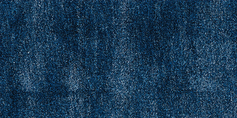 Texture of blue denim close-up. Modern high-quality material for clothes. fabric surface background