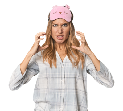 Blonde in pajamas with sleep mask screaming with rage. - Powered by Adobe