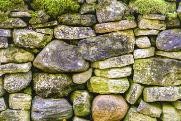  A wall made of small granite boulders