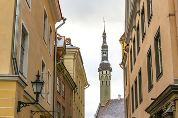  View of a medieval tower through a street in the old town