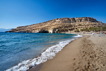 People on sandy beach of Matala on Crete island