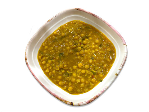 White chickpeas curry in a plate isolated on white background