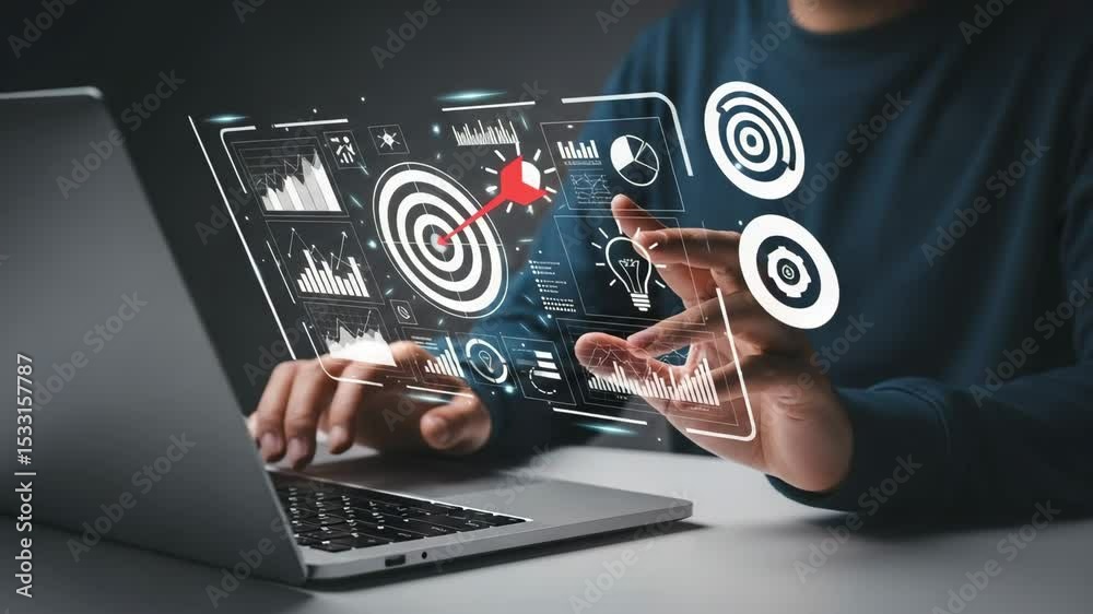 Poster Man using laptop with digital overlay of target, graphs, and data visualizations displayed