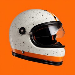 Off-white motorcycle helmet with orange stripe and speckles, clear visor, against vibrant orange background