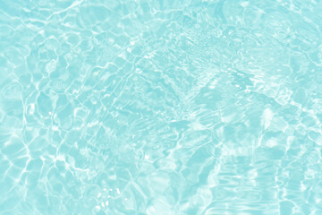 Blue water with ripples on the surface. Defocus blurred transparent blue colored clear calm water...