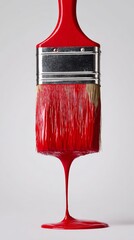 Red paintbrush dripping vivid paint in an artistic close-up photography