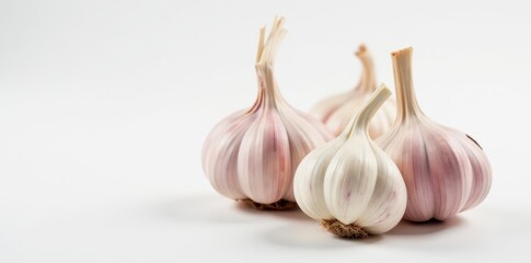 Obraz premium Whole fresh garlic bulbs, papery skin, white background, still life, food, spice