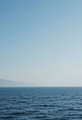 Fototapeta premium Surfing day on a sunny coast with calm waters and gentle waves for the perfect riding experience