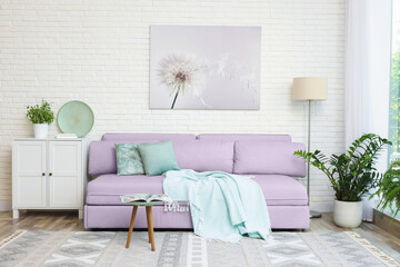 Stylish living room with comfortable sofa and other furniture. Interior design